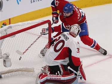 Montreal Canadiens' Alex Galchenyuk tries to make play behind Ottawa Senators goalie Andrew Hammond during third-period action in Montreal on Wednesday, April 15, 2015.