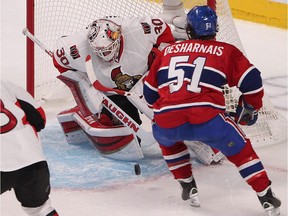 Canadiens' David Desharnais gets in close on Senators goalie Andrew Hammond during second-period action in Montreal on Wednesday April 15, 2015.