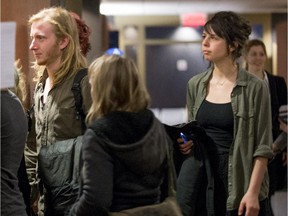 Two of the four accused smoke bombers, left François Vivier Gagnon and on the right Vanessa L'Écuyer enter the courtroom in Montreal.