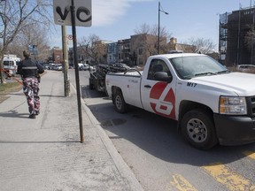 A Bixi pickup truck with a trailer full of bike leaves the scene of an accident involving a cyclist on Sherbrooke St. E. near La Fontaine Park in Montreal Friday, April 17, 2015.