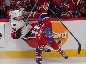 Montreal Canadiens' Brendan Gallagher and Ottawa Senators' Mark Borowiecki go down on the ice following check during first period action in Montreal on Friday April 17, 2015. The Montreal Canadiens meet the Ottawa Senators in the first round of the NHL playoffs. (Pierre Obendrauf / MONTREAL GAZETTE)