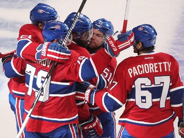 Montreal Canadiens' P.K. Subban, centre, brings out his arm to Max Pacioretty (67), following P.K.'s goal during second period action in Montreal on Friday April 17, 2015. The Montreal Canadiens meet the Ottawa Senators in the first round of the NHL playoffs. (Pierre Obendrauf / MONTREAL GAZETTE)