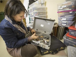Melanie Marsolais of the Maison Victor Gadbois, in Beloeil,  looks through a collection of  items that have been confiscated at the airport in Dorval.
