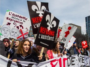 Protesters take part in a large anti-austerity demonstration in Montreal on Thursday, April 2, 2015.