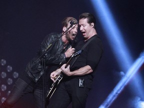 Ryan Tedder, left, lead singer of OneRepublic and guitarist Zach Filkins perform at the Bell Centre on Monday April 20, 2015.