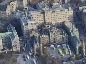 Ambulances outside the Royal Victoria Hospital wait to take patients to the new Glen Site in Montreal Sunday, April 26, 2015.