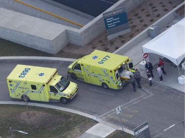 An ambulance is loaded up after a patient was brought to the MUHC's Glen Site in Montreal Sunday, April 26, 2015 after being transported from the Royal Victoria Hospital on Mount-Royal as part of the largest hospital move in Canadian history.