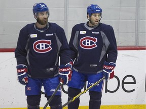 Canadiens defencemen Greg Pateryn and Mike Weaver take a breather during practice at the Bell Sports Complex in Brossard on April 23, 2015.