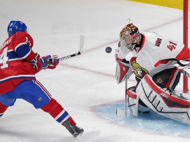 Ottawa Senators goalie Craig Anderson, right, makes a save against Montreal Canadiens center Tomas Plekanec, left, during the second period of game five of their NHL Eastern Conference quarter-final match at the Bell Centre in Montreal on Friday, April 24, 2015. (Dario Ayala / Montreal Gazette)