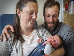 Parents Marie Brilleaud and Sylvain Perreault with baby Arthur, the first baby born at the new Royal Victoria Hospital at the MUHC's Glen site.