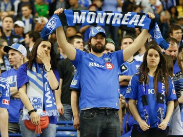 Fans  of the Montreal Impact show their disappointment at the end of the final game of CONCACAF Champions League final between Montreal Impact and Club America from Mexico City in Montreal at the Olympic Stadium, Wednesday, April 29, 2015. Club America won the series.