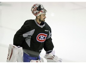 Montreal Canadiens goalie Carey Price smiles at a teammate during practice at the team's training facility in Brossard on Wednesday. April 29, 2015.