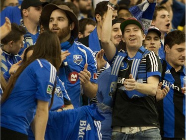 Montreal Impact fans cheer prior to the start of the final game of CONCACAF Champions League final between Montreal Impact and Club America from Mexico City, in Montreal Wednesday, April 29, 2015.