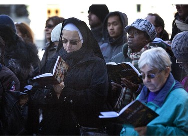 Hundreds of faithful of all ages and backgrounds prayed outside Notre Dame Basilica as part of the Via Crucis (Way of the Cross) procession. Friday April 3, 2015.