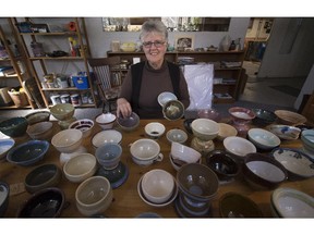 MONTREAL, QUE.: APRIL 4, 2015 --  Susan Weaver of Pointe Claire, Saturday, April 4, 2015, with many of the bowls for destined The first ever Empty Bowls event will be held April 18 in the West Island at the St. Columba By the Lake church in Pointe-Claire. Potters belonging to the Baie d'Urfe Potters Guild, Claycrafters in Pointe-Claire and the Dorval Potters Guild are making the hundreds of bowls that will be filled with soup and sold for $25 each as part of this major fundraising event to fight hunger in the West Island.(Peter McCabe / MONTREAL GAZETTE)