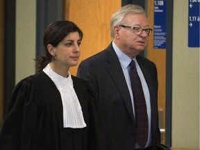 Former Laval mayor Gilles Vaillancourt with his lawyer at the courthouse in Laval, north of Montreal, Tuesday April 7, 2015.
