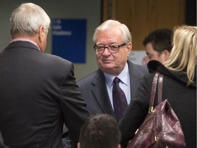 Former mayor of Laval, Gilles Vaillancourt snakes hands with his brother at the courthouse in Laval, north of Montreal, Tuesday April 7, 2015.