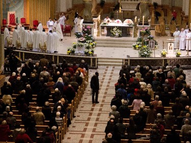 A crowd several times larger than the normal 5 p.m. mass attend a special service at Mary Queen of the World Basilica for Archbishop Jean-Claude Turcotte in Montreal on Wednesday April 8, 2015. Turcotte died Tuesday night at age 78.