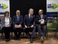 Quebec Premier Philippe Couillard, second from right, with ministers Lucie Charlebois, Pierre Arcand,  and Geoffrey Kelley at a conference where the  government unveiled a revamped Plan Nord April 8, 2015.