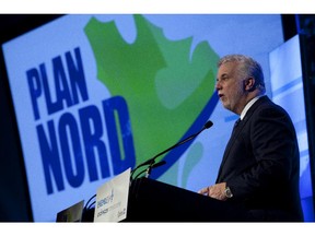 Quebec Premier Philippe Couillard addresses the audience at a conference where the  government unveiled a revamped Plan Nord in Montreal, Wednesday April 8, 2015.