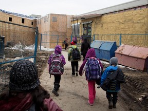 Students return to Ecole des Nations in the Cote-des-Neiges district on Wednesday April 8, 2015. The students are bussed to other schools as work to remove mould in the school continues.