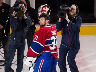 Montreal Canadiens goalie Carey Price waves to the crowd after beating the Detroit Red Wings at the Bell Centre in Montreal on Thursday April 9, 2015. Price set a new team record with 43 regular season wins.