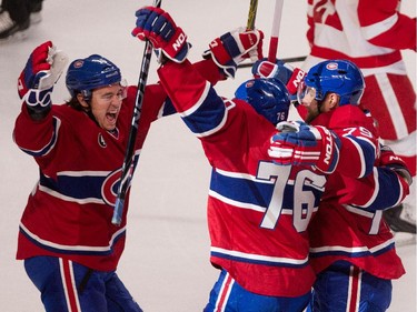 Montreal Canadiens right wing P.A. Parenteau, left, celebrates with Montreal Canadiens defenceman P.K. Subban and Montreal Canadiens defenceman Andrei Markov, right after Markov scored against Detroit Red Wings goalie Jimmy Howard during NHL action at the Bell Centre in Montreal on Thursday April 9, 2015.