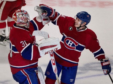 Canadiens' Brendan Gallagher celebrates with goalie Carey Price during NHL action against the Detroit Red Wings at the Bell Centre in Montreal on Thursday April 9, 2015. Price set a new team record with 43 regular season wins.