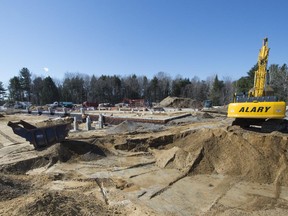 Excavation equipment and work crews working on the site of the town of St-Lazare's new fire station on Monday, April 13, 2015.