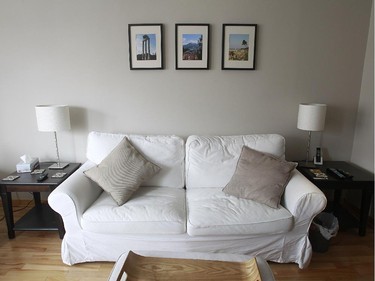 Three framed photos taken in Italy decorate Adam Allouba' s living room.