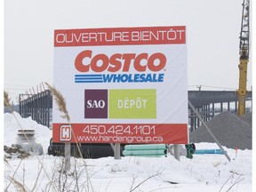 A billboard near St- Charles Ave. in Vaudreuil-Dorion announces the openign soon of Costco next to the SAQ Dépôt store.