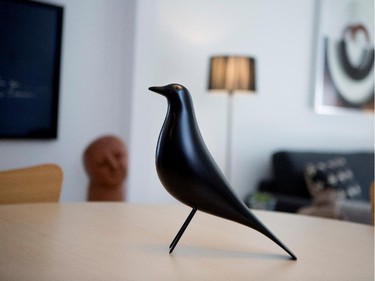 A wooden crow sits in the centre of the kitchen table.