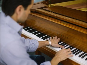 Plastic surgeon Dr. Mirko Gilardino plays the piano at his home in Montreal on Sunday, March 22, 2015. He is playing Sentimental Walk, by Vladimir Cosma.