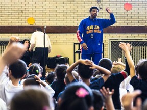 MONTREAL, QUE.: MARCH 26, 2014 -- Anthony "Buckets" Blakes of the Harlem Globetrotters speaks to children about bullying at Westmount Park Elementary School in Montreal on Wednesday, March 26, 2014. (Dario Ayala / THE GAZETTE) ORG XMIT: 49510