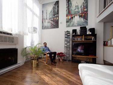 Amin Noorani sits in his reading chair in his home in St. Henri district of Montreal.