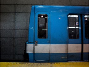 An STM metro train arrives at a station.