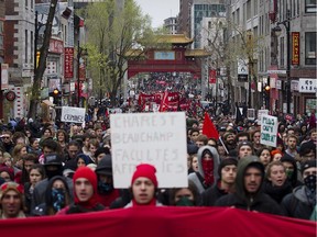 Protesters march up St. Laurent boulevard in Chinatown during the anti-capitalist May Day protest in Montreal on Tuesday, May 1, 2012.