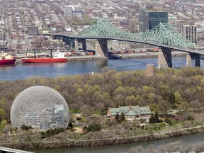An aerial cityscape view of  Montreal, seen from the South Shore showing Parc Jean Drapeau in the foreground with the Biosphere, and the Jacques Cartier Bridge just behind, Friday May 6, 2011.  ( Phil Carpenter/ THE GAZETTE)