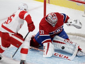 Goalie Carey Price of the Montreal Canadiens stops Tomas Jurco of the Detroit Red Wings in Montreal, on Tuesday, Oct. 21, 2014 in NHL action at the Bell Centre.