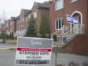 An Israeli flag flies next to a home for sale on David-Lewis St. in Côte-St-Luc. Many Jewish Europeans, fleeing anti-semitism in countries such as France, are buying up properties in Montreal.