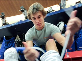 Mark MacMillan unties his skates after on-ice session at the Montreal Canadiens development camp at their training facility in Brossard, Que., south of  Montreal,  July 8,  2010.