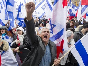 Henry Dahan cheers with others during a celebration of the state of Israel, at Place des Festivals in Montreal, Thursday April 22, 2015.