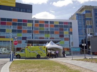 Paramedics and hospital staff remove a baby in an incubator from an ambulance at the MUHC Glen site, during a move of patients and equipment from the Royal Victoria Hospital on Sunday, April 26, 2015.