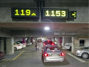 Electronic signs at the parking lot for the MUHC Glen site indicate where parking spots are available. The high cost of parking, up to $25 for the day, has irked many who use the Glen site.