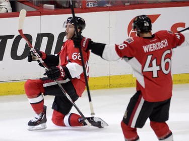 Ottawa Senators' Mike Hoffman (68) celebrates scoring on the Montreal Canadiens with teammate Patrick Wiercioch during third period Stanley Cup NHL playoff hockey action in Ottawa on Wednesday, April 22, 2015.