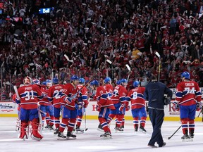 Members of the Montreal Canadiens wave to fans after defeating the Ottawa Senators in overtime during Game Two of the Eastern Conference Quarterfinals  Friday at the Bell Centre.