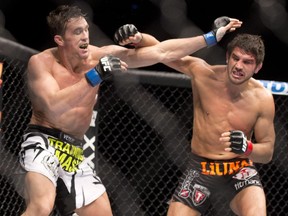 Patrick Cote, right, of Montreal, fights Kyle Noke, of Albuquerque, NM, on April 16, 2014 at the UFC Fight Night in Quebec City.