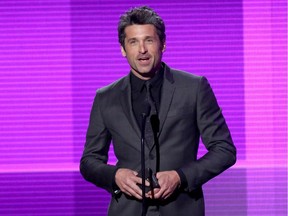 Patrick Dempsey presents an award at the American Music Awards in 2014.