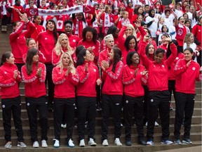 Members of the Canadian national women's soccer team celebrate after the roster for the 2015 FIFA Women's World Cup was announced, in Vancouver, B.C., on Monday April 27, 2015.