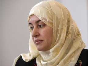Rania El-Alloul takes part in a news conference Friday, March 27, 2015, in Montreal. El-Alloul is seeking a declaratory judgment after a Quebec judge refused to hear her case because she was wearing a hijab.